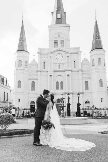 bride and groom kissing in Jackson Square in New Orleans