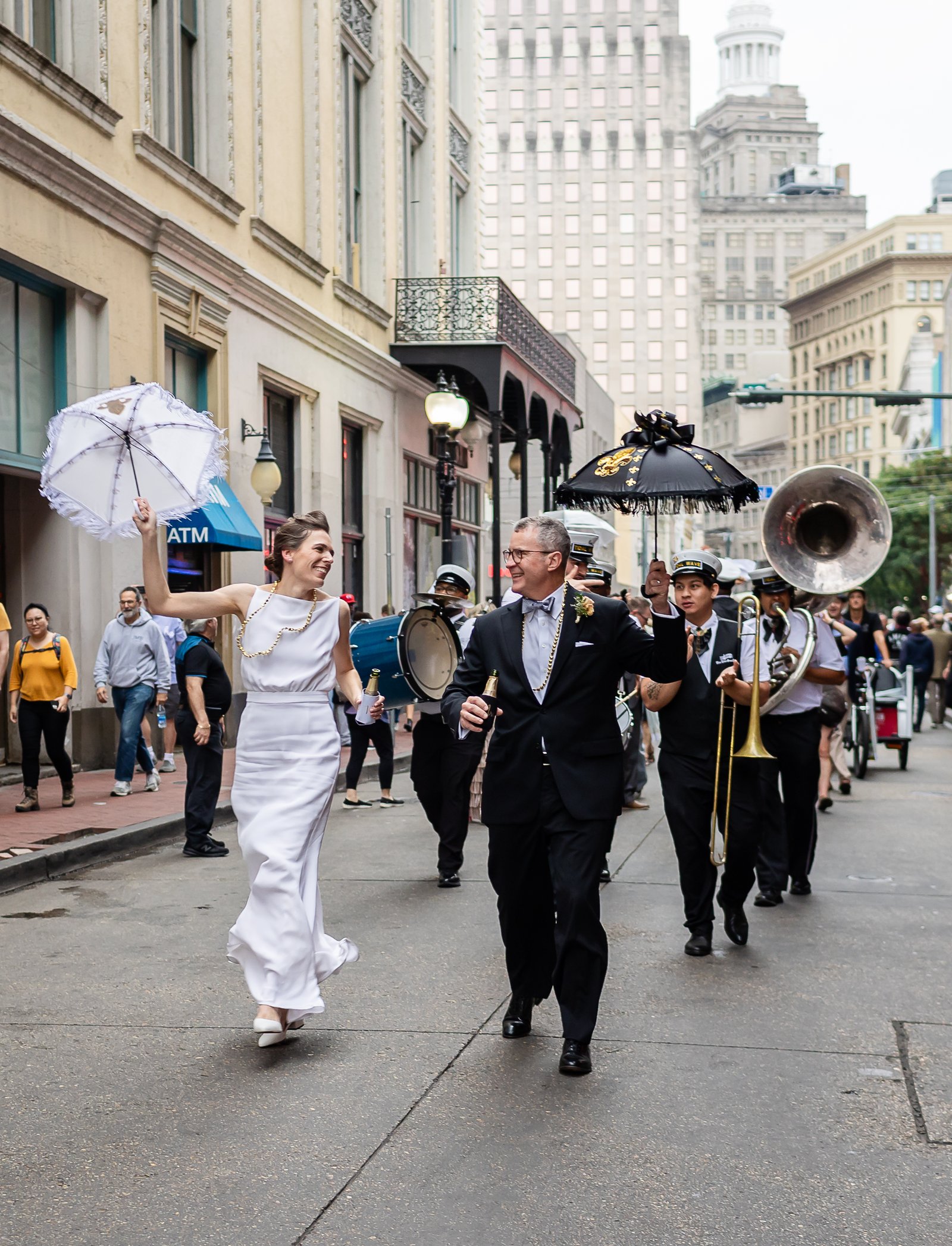Bride and groom second lining in New Orleans