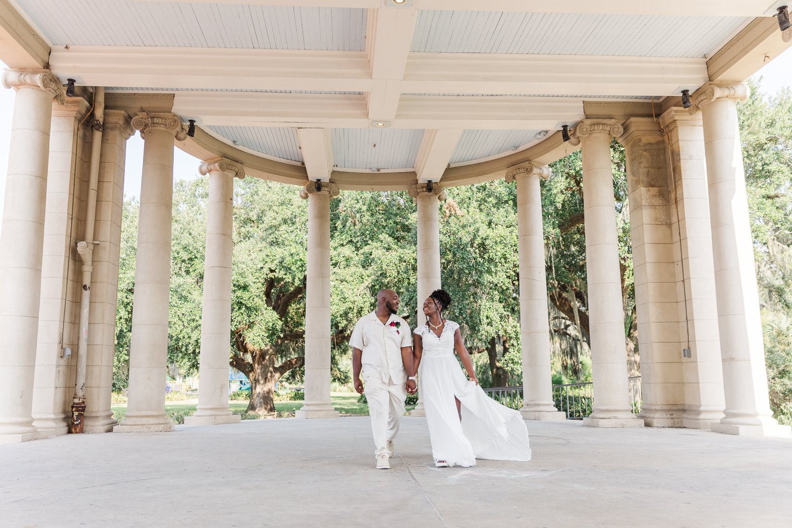 Bride and groom eloping in City Park New Orleans under oak trees