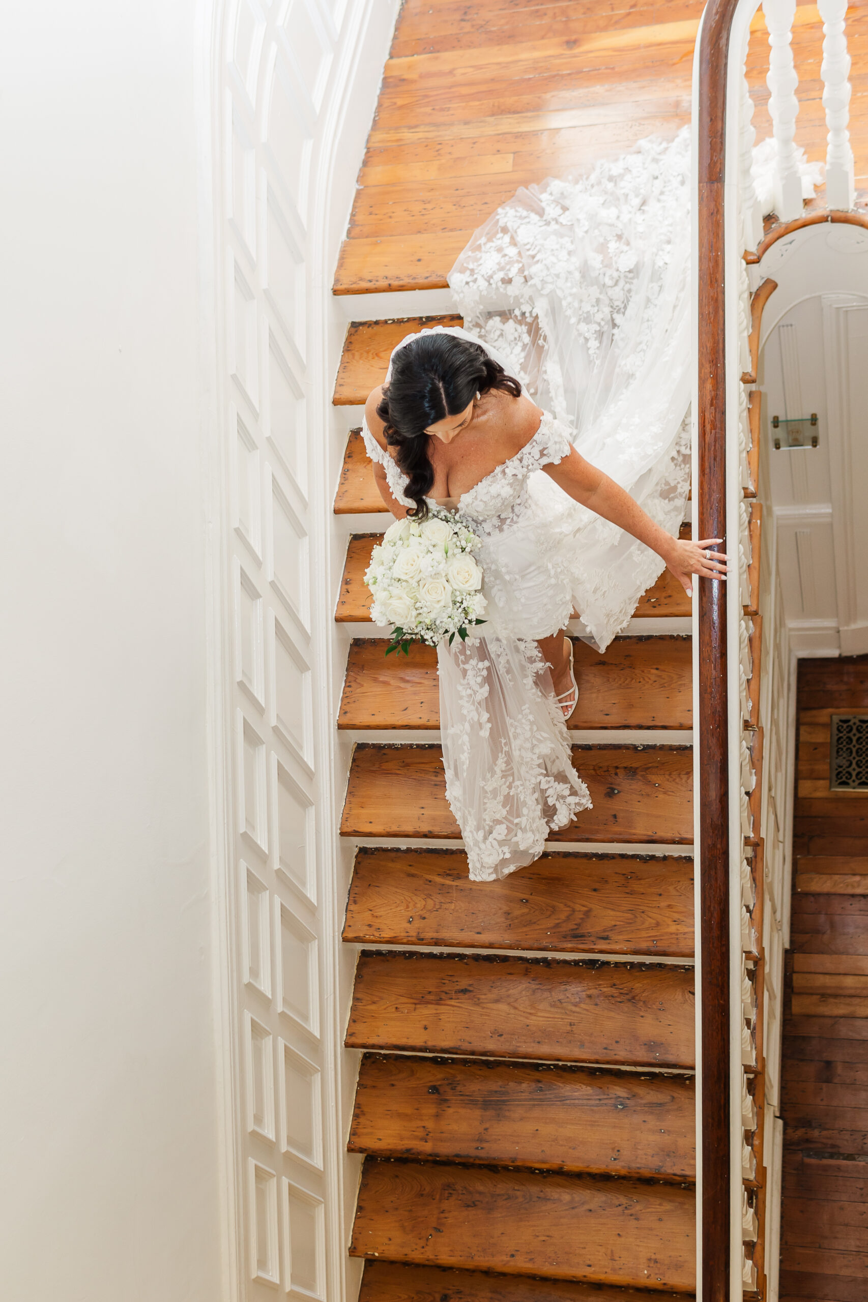 bride at Solari Orleans walking down stairs at a New Orleans wedding venue