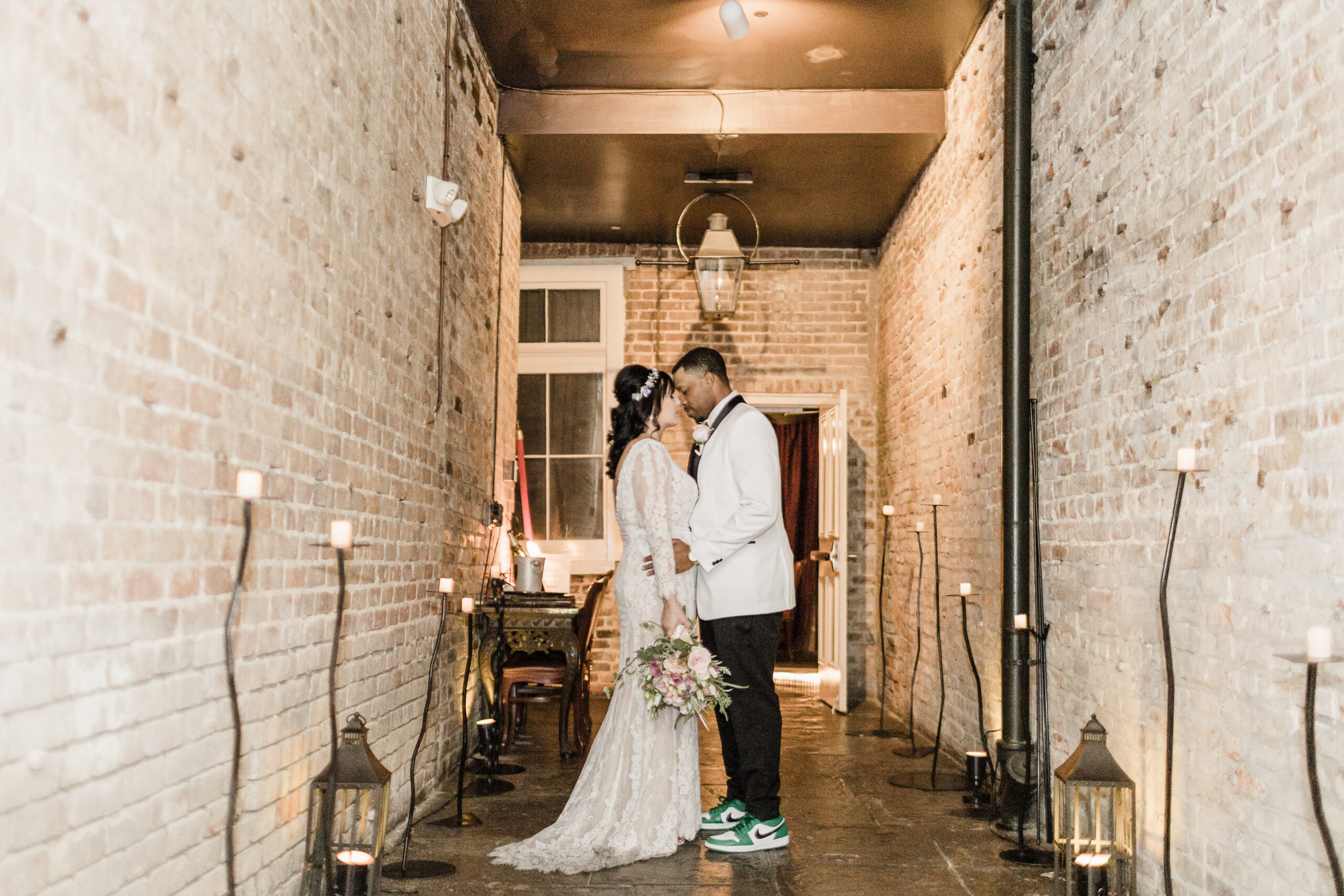 just married couple posing at Muriels new Orleans in a secret alley