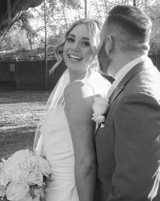 black and white of couple sharing a laugh in new orleans while eloping