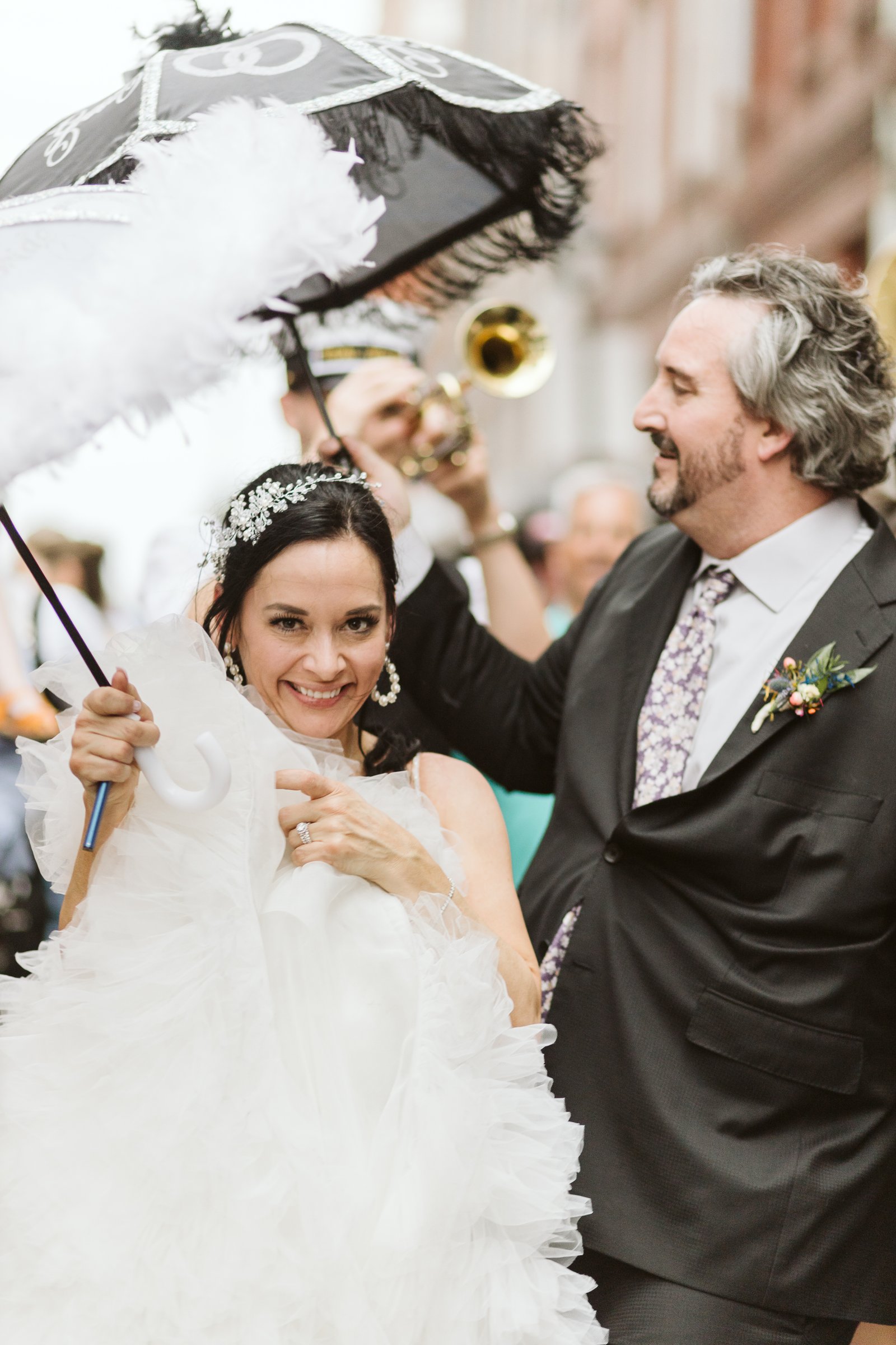 Elopement couple celebrating with brass band