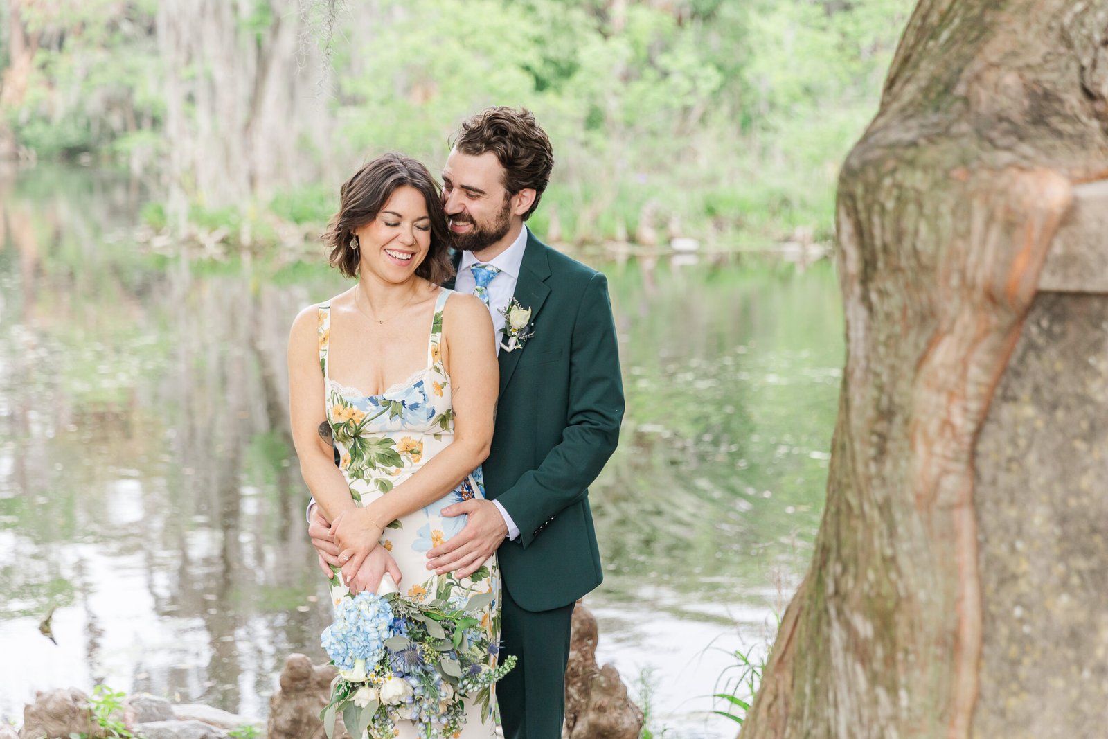 Just-eloped couple taking in a moment under sunlit trees in City Park
