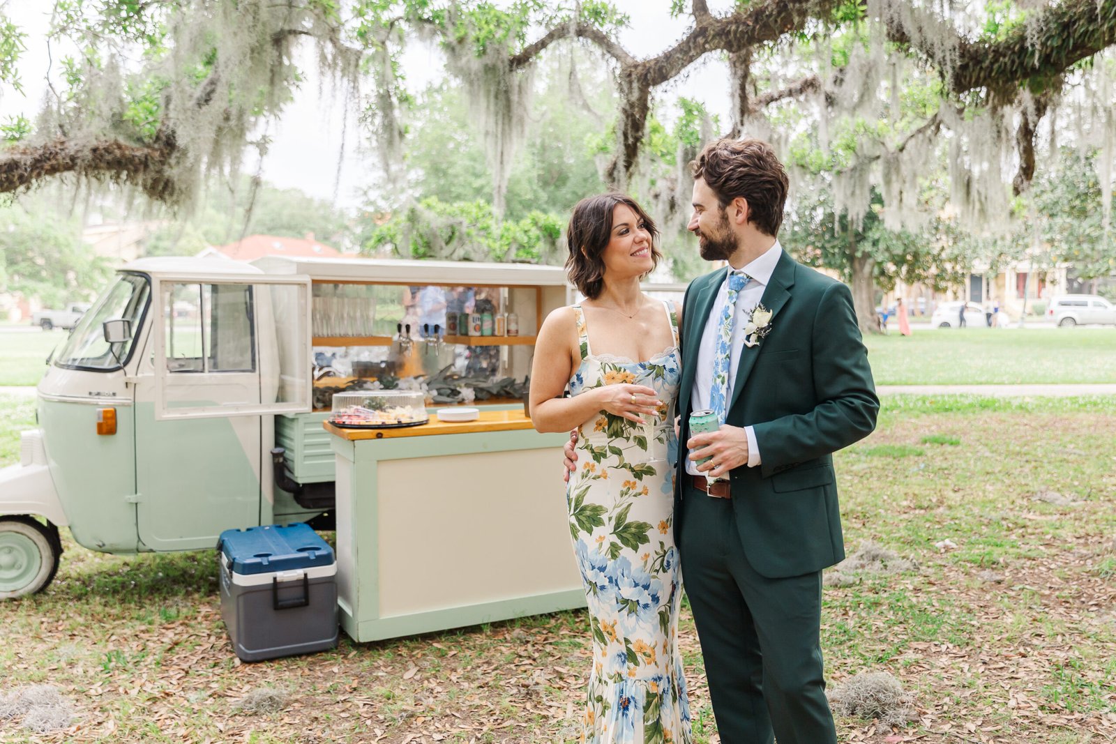 Couple embracing under moss-draped trees in City Park