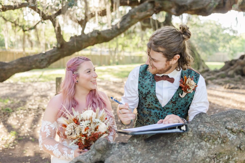 Bride and groom beneath ancient oak at Tree of Life