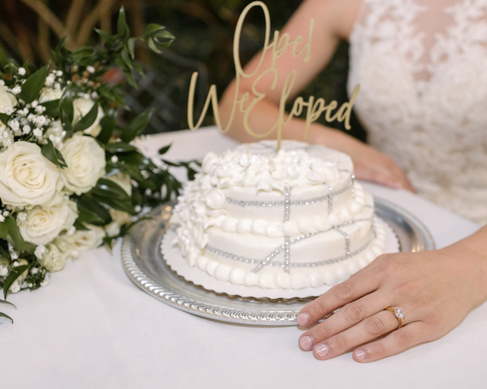Newlyweds celebrating their Biloxi elopement with a petite cake
