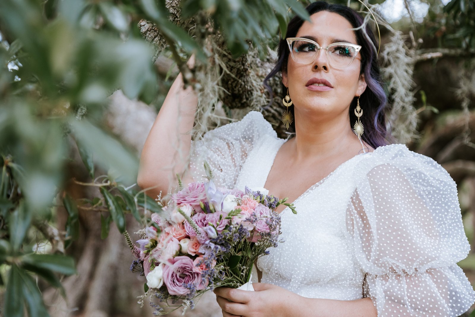 Elopement photo with sweeping oak branches overhead