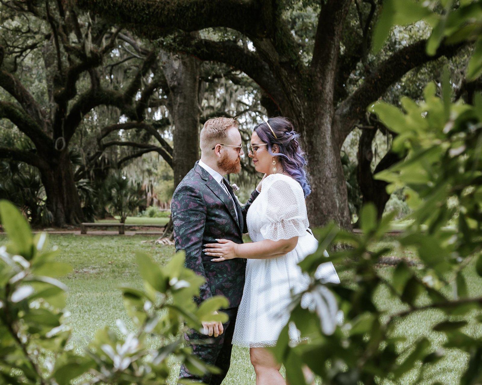 Newlyweds standing still in quiet City Park setting
