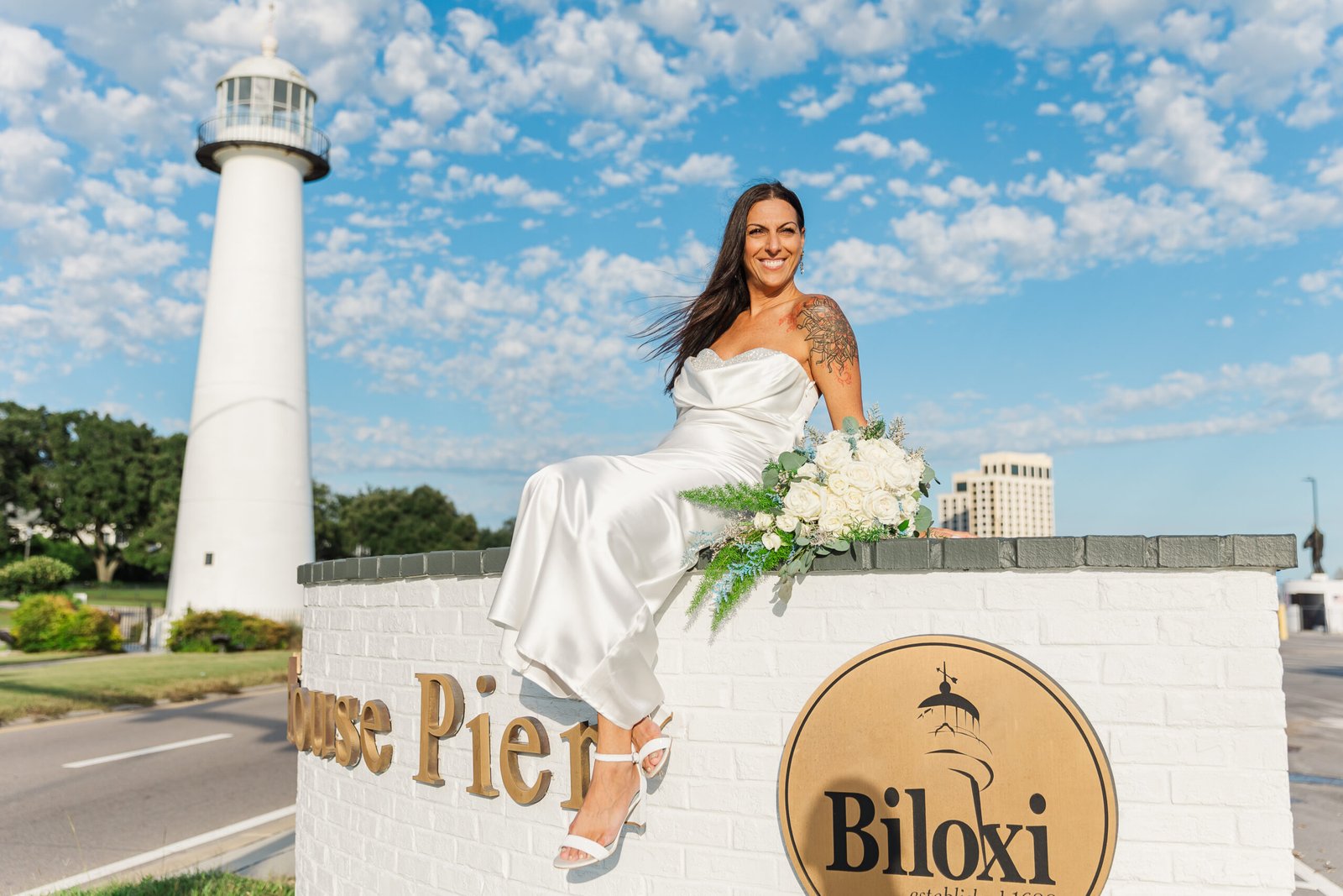 Couple eloping with Biloxi lighthouse in the distance