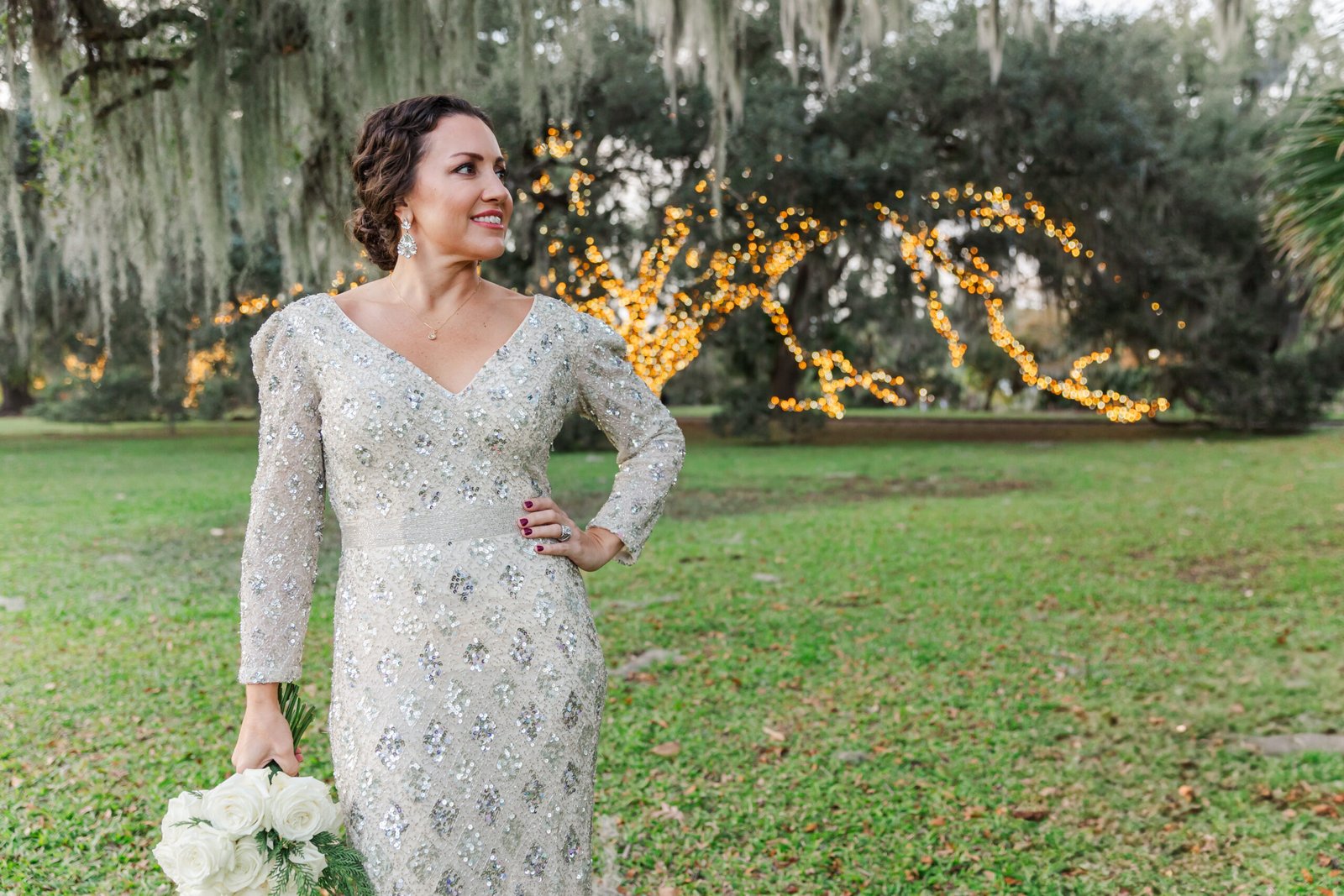 Eloping bride framed by lush greenery in City Park