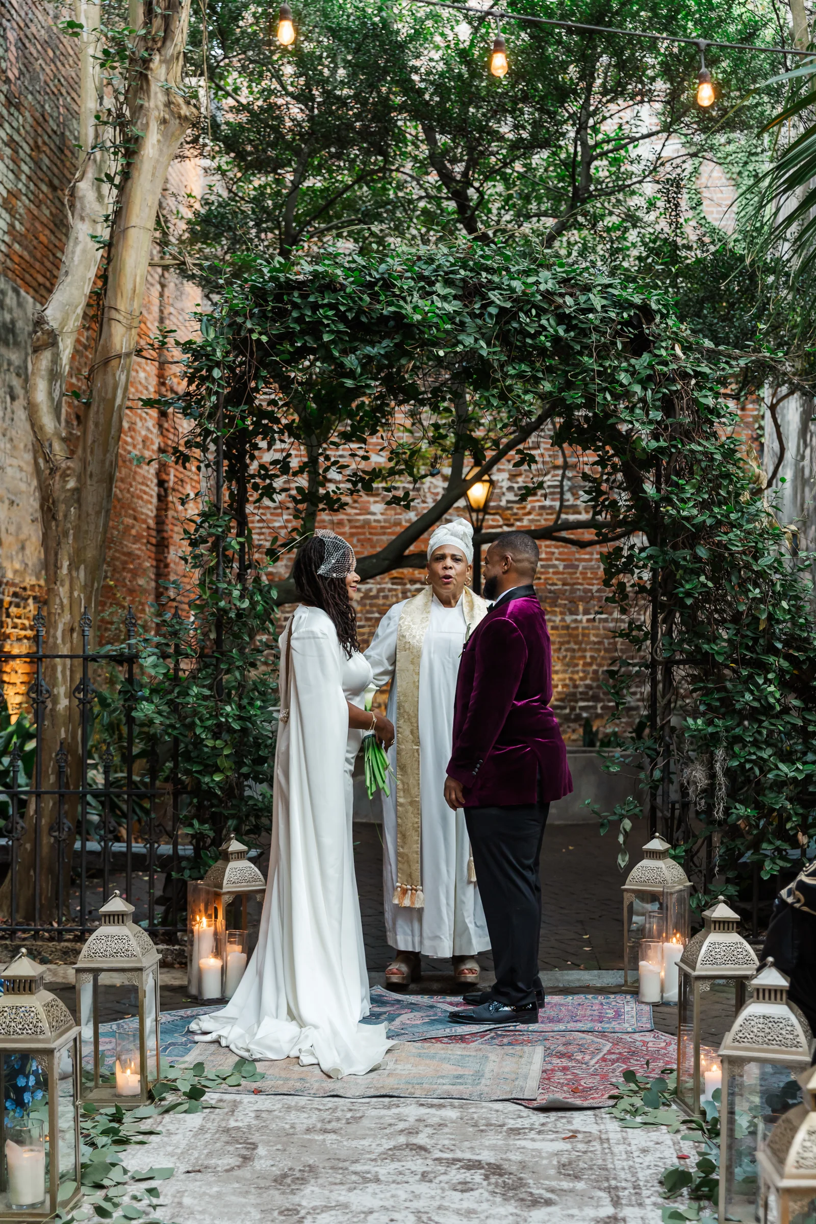 Couple marrying at the New Orleans Pharmacy Museum courtyard