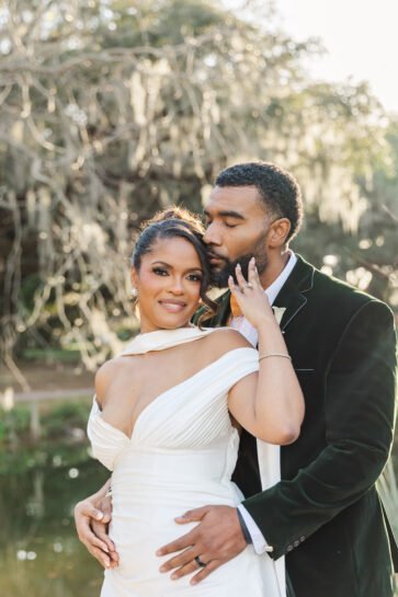 couple enjoying a sweet moment after eloping in city park New Orleans with Ibay Photography