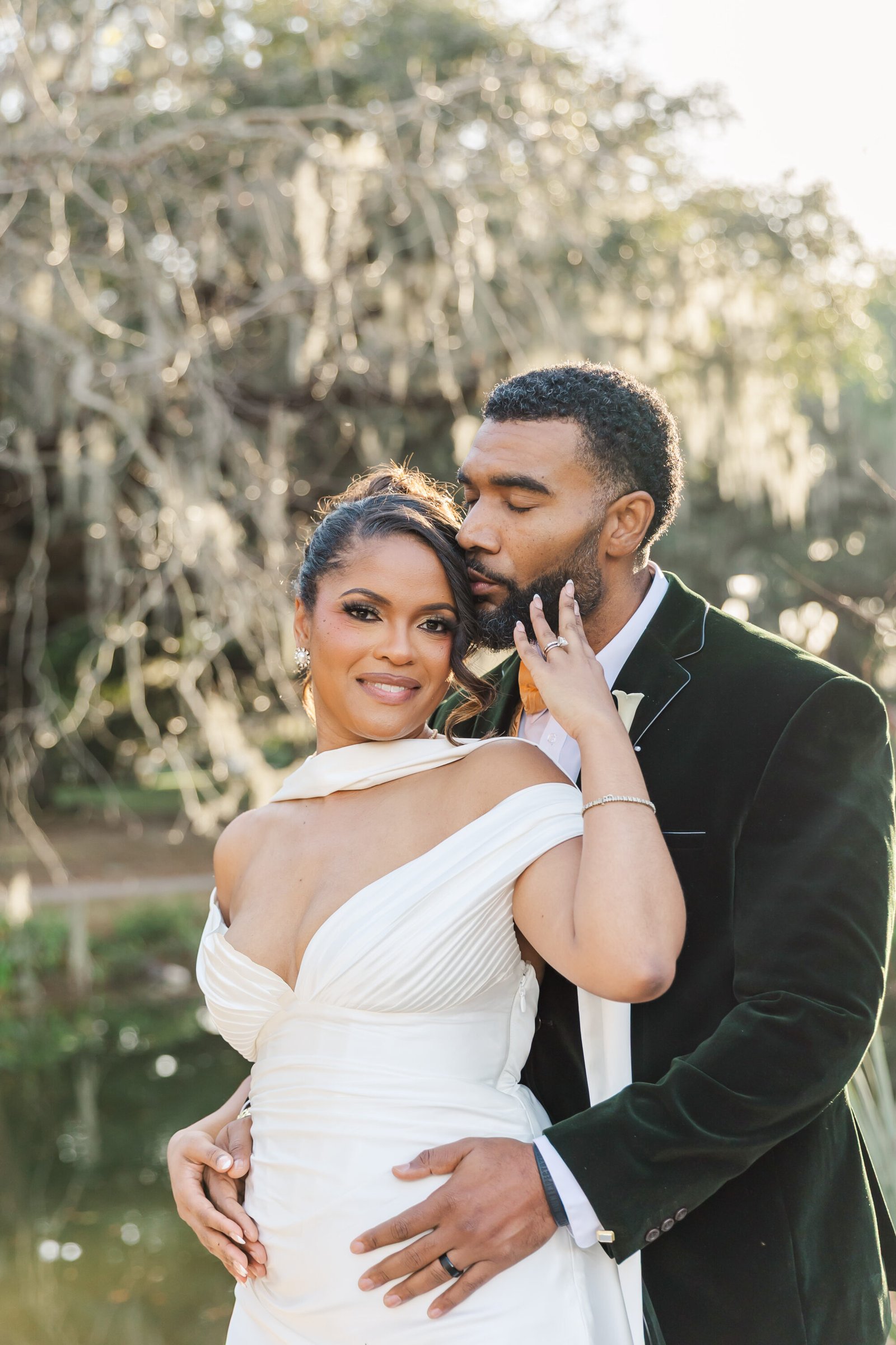 couple enjoying a sweet moment after eloping in city park New Orleans with Ibay Photography