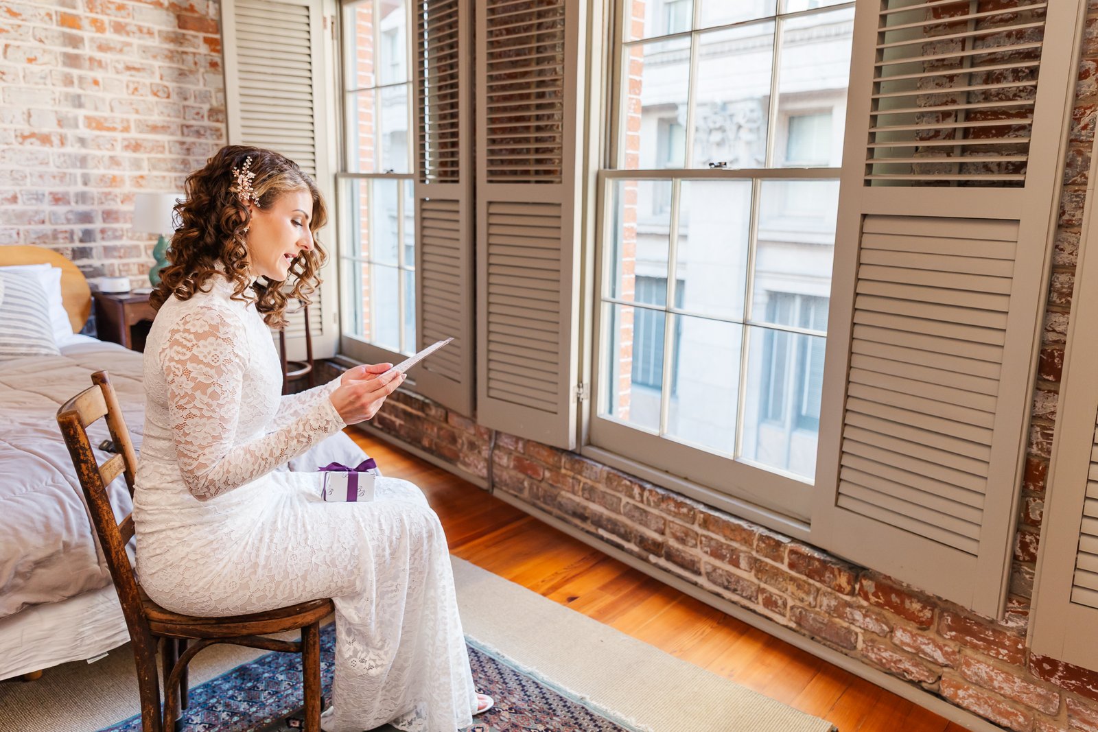 new orleans elopement photographer capturing a bride getting ready in a historic hotel