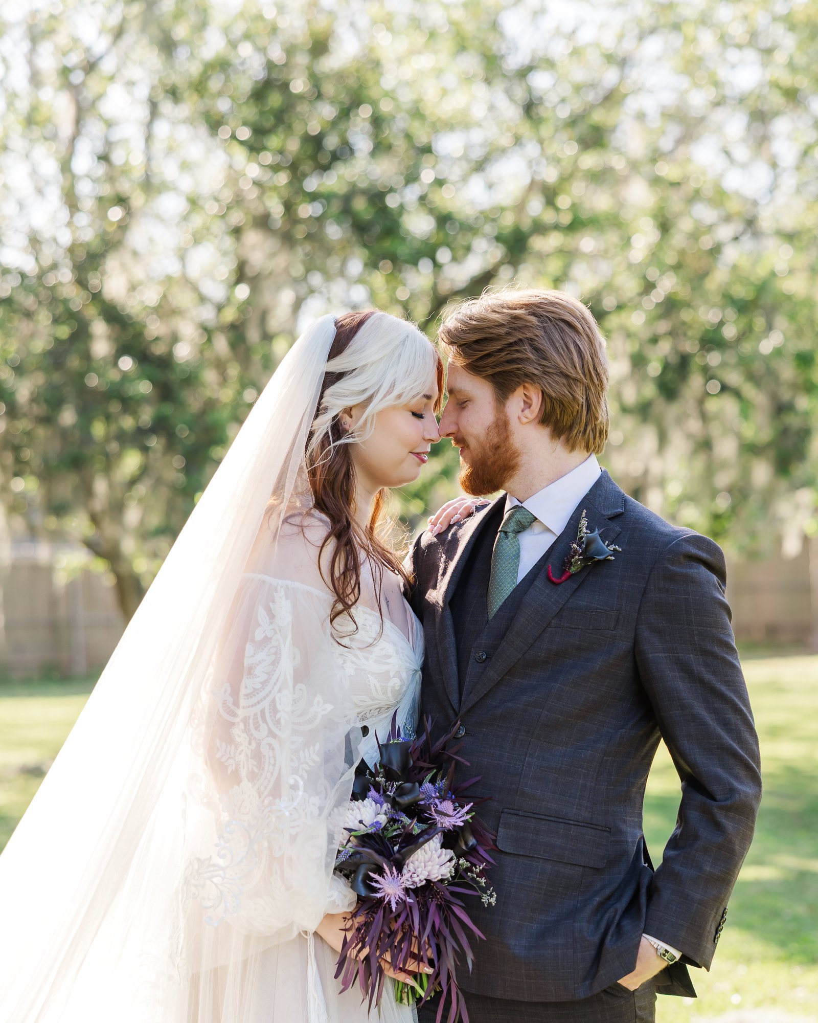 intimate new orleans elopement wedding portrait with blue bouquet