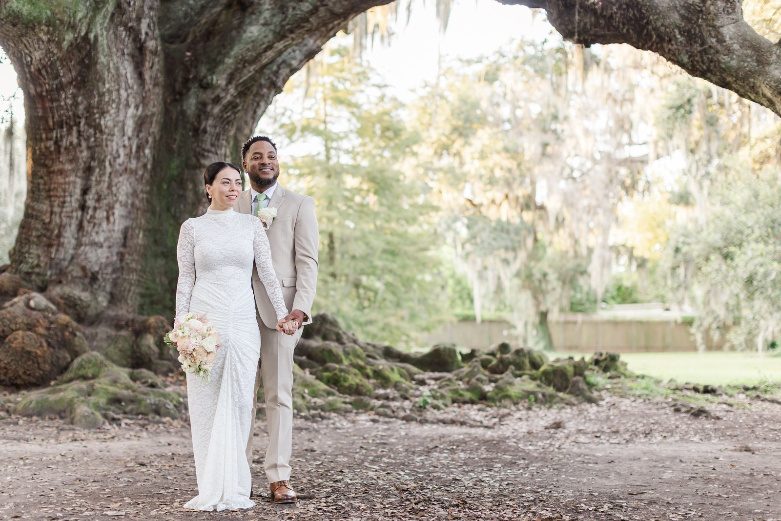 New Orleans elopement photographer capturing bride and groom under the Tree of Life oak tree in Audubon Park