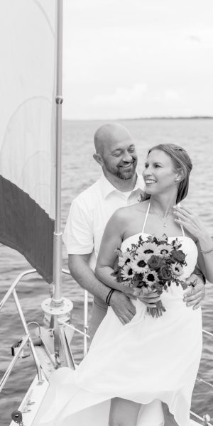 black and white photo of couple getting eloped in New Orleans on a sailboat